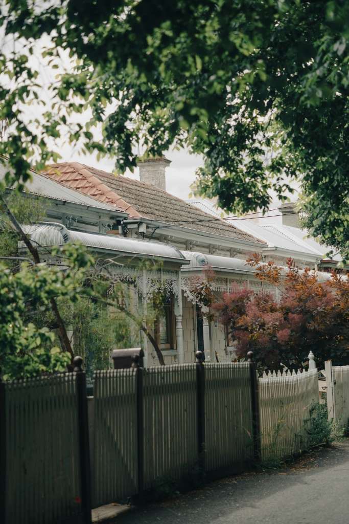 Melbourne home behind a picket fence on a leafy inner suburban street
